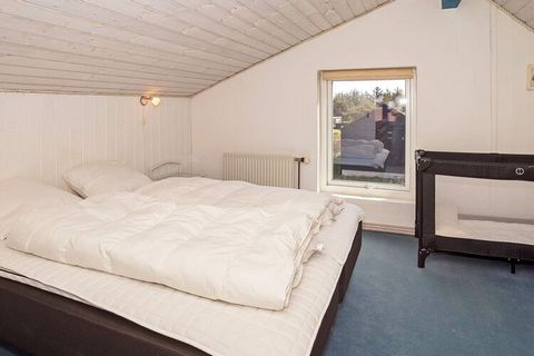 This holiday home with swimming pool has a central location in the fishing village of Vorupør. The pool room has a 18 m² large swimming pool and a whirlpool, as well as a sauna. The house is heated with remote heating that gives cheaper and more envi...