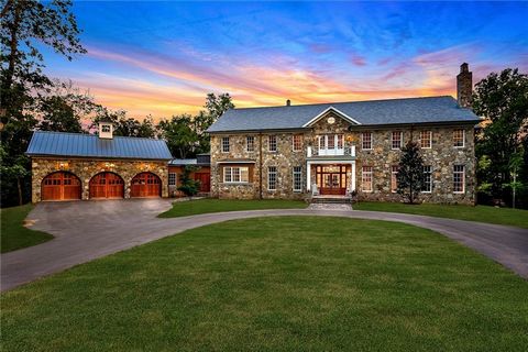 Nestled on 58+/- acres off Sugar Creek Rd just 5.9 miles to thriving downtown Bentonville and 4.5 miles to Walmarts new Home Office, this ONCE-IN-A-LIFETIME purchase opportunity boasts an exceptional custom-built 8128 sq ft estate, an equestrian aren...
