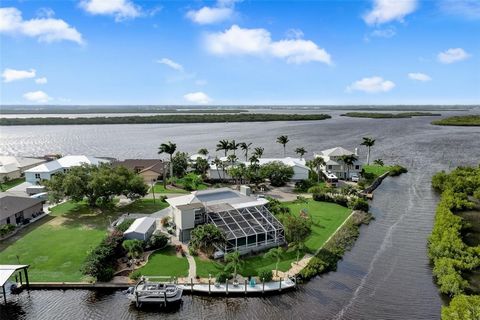 Welcome to your slice of paradise in the serene Harbor Heights of Punta Gorda! Nestled on three waterfront 'tip' lots, this stunning split-level pool home boasts unparalleled views of Peace River, Charlotte Harbour, and the natural preserve that surr...