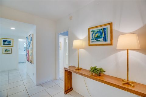 Simply lovely, bright and cheery corner first floor unit with gorgeous garden and pond views. Beautifully updated kitchen and bathrooms with extended living area. Extra special and large primary bedroom. Walk to the beach or relax by the community po...