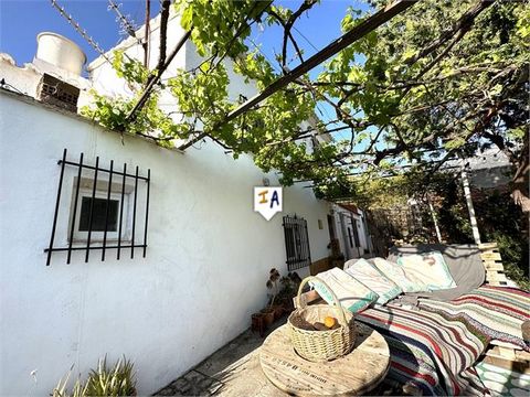 Exclusive to Us. Lovely Cortijo with 3 bedrooms and a large private front terrace with spectacular countryside and mountain views. You enter the Cortijo via the front garden into the living room, continuing to the left to find a family kitchen with p...