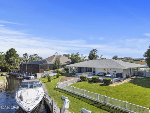 Welcome to WATERFRONT luxury in the gated community of Bay Point on Panama City Beach, Florida! This single level, fully-renovated home sits on 110' water frontage with deep water and offers a 10K boat lift and boat slip. Enjoy the waterfront lifesty...