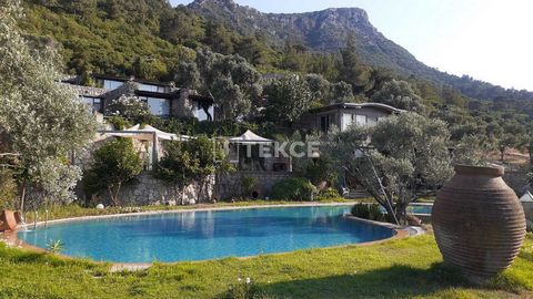 Natural Living Complex Made of Custom Stone Country Houses in Bodrum Gölköy The sea-view country houses are located in Gölköy, one of Bodrum's most popular holiday destinations. Furnished stone structures with a mystical atmosphere are nestled in a f...