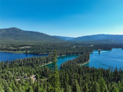 Escape to Loon Lookout, a private 40-acre parcel in Montana, featuring stunning views of the Thompson Chain of Lakes. This hidden gem, surrounded on 3 sides by Montana State lands, offers ultimate privacy and a pristine natural environment. Just 45 m...