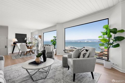 This newly renovated penthouse condo is perched atop San Francisco's famed Telegraph Hill, nestled amongst trees and just steps from Coit Tower. Enjoy this two bed, one bath with unobstructed views of the Bay, Treasure Island and the Bay Bridge. The ...