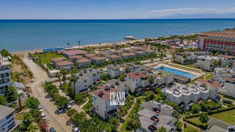 A stunning three-story villa is available for sale in the Lara Kent Holiday Complex, situated by the sea. This complex is part of the well-established Boğazkent project, located in Serik, a favored district of Antalya. The villa benefits from the ser...