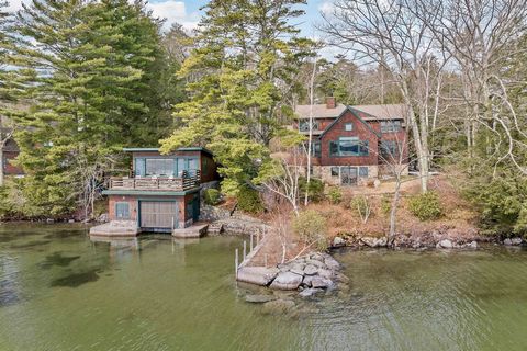 One of a kind Adirondack Lake House in highly desirable Gilford. With a large level lot offering unparalleled privacy make this property a haven for relaxation and enjoyment. Wake up to stunning nature's beauty, with the expansive beautifully landsca...