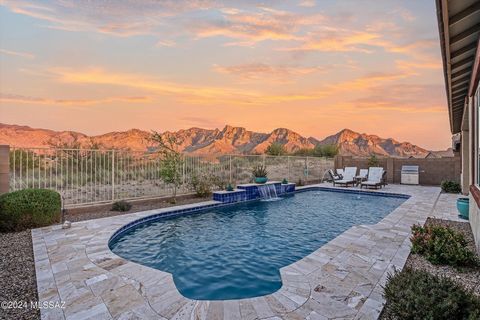 Absolutely stunning 5BD/3BA home with pool & breathtaking mountain views in the Villages of Silverhawke community. The exceptional views of the Catalina Mountain, visible from anywhere in the backyard, will not disappoint. Whether in the pool or rela...