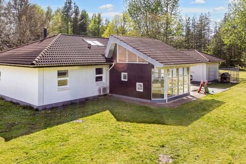 Cozy and secluded cottage by Virksund with path system to good beach, marina m.m. The cottage is well furnished and also has a good conservatory of 25 m2 with bio fireplace, wooden floor and an extra bed. From the entrance hall there is access to a b...