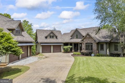 Welcome to 318 and 324 Edgewater Trail, Toccoa, GA 30577 - where timeless elegance meets modern luxury on a sprawling 2.05-acre parcel. This exceptional property boasts a 5865-square-foot house on a private lot, offering the perfect blend of space, p...