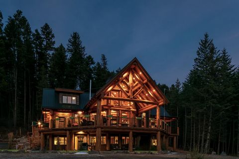 Discover mountain living at its finest! This exquisite log and timber home, along with a charming carriage home, offers a unique opportunity to embrace the beauty of the Rocky Mountains. Situated on just over 3 acres, this property is only a 15-minut...