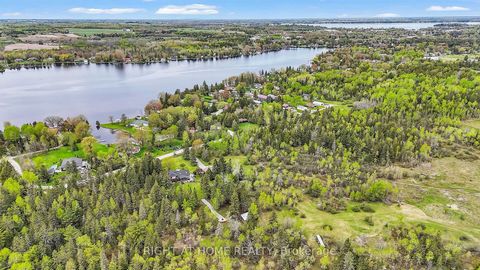 Unprecedented privacy! Step into your own slice of paradise at Paradise House! Nestled on a tranquil 2.47-acre lot steps away from the serene shores of Sturgeon Lake, this newly renovated custom-built 4 Level Side Split Bungalow invites you to indulg...