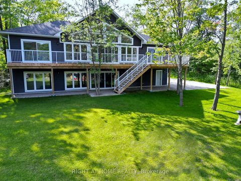 Welcome to your slice of paradise- this newly built waterfront cottage is nestled on 2.2 acres with 240 feet of waterfront on Little Lake/Gloucester Pool. It offers a 5 bedroom, 3.5 bath with multiple walk outs to a large deck that is perfect for ent...