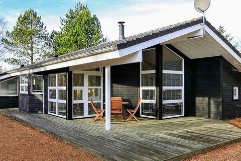 Holiday home on a natural plot in Lodskovvad near Ålbæk. The cottage appears bright and stylish with an open kitchen with good dining area and living room with wood stove and heat pumps. There are three spacious rooms, two bathrooms with underfloor h...