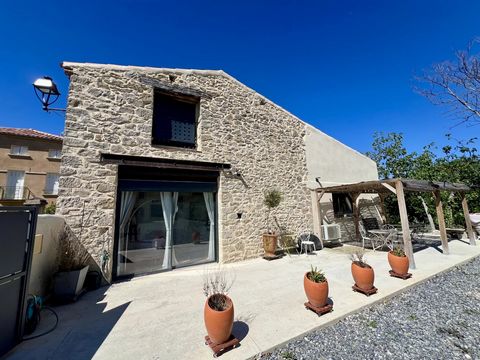A stylish renovated stone agricultural building on the edge of a village close to Limoux with an attached mediterranean-style garden and a barn. On the ground floor, a living room with a wood stove and french doors leading to the sun terrace and gard...