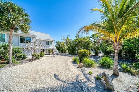 Experience Island living in this stunning elevated duplex nestled on a tranquil cul-de-sac within the sought-after Dunes Golf & Tennis Community. As you arrive, you'll be greeted by blooming Frangipani and flourishing palm trees, surrounded by lush t...