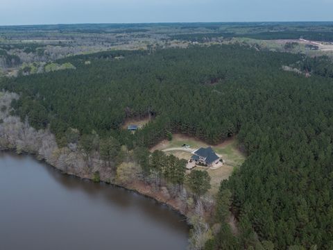Beautiful Estate home with all the bells and whistles one can think of. 3 Bedroom home, freshly updated, with Primary on main level. The ultimate in privacy, this home is situated on 93 acres which front on a pristine lake (owned by another party) bu...