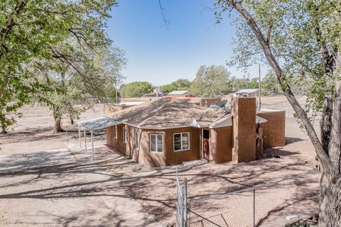 Hurry to see this hard to find home with land opportunity conveniently located in the heart of Albuquerque's South Valley. Fully updated home sitting on 1.61 acres, offering a 3800+sf garage/workshop/storage facility with electricity connected!! In t...