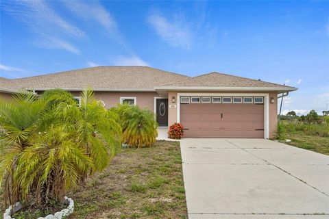 Welcome to your dream villa in Port Charlotte! This stunning 3-bedroom, 2-bathroom, 2-car garage home offers the perfect blend of comfort and luxury across its spacious 1368 square feet. As you step inside, you're greeted by elegant plank tile floori...
