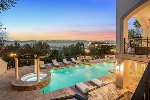 Nestled within The Summit, an exclusive gated community along Mulholland Drive, resides 12063 Crest Court, offering unparalleled vistas in the prestigious Beverly Hills zip code. Spanning three levels, this refined sanctuary boasts six bedrooms and s...