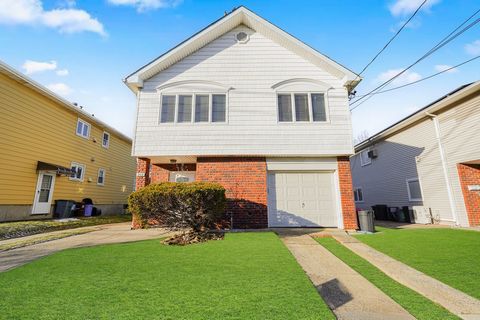 Legal 2 Family detached home in convenient location. Main home features open floor plan, vaulted ceiling skylight, wood floors, 3 bedrooms, full bath with dual access from main bedroom. The apartment on first floor and features work kitchen, 2 bedroo...