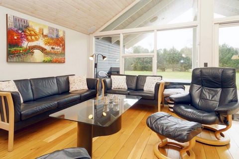 Holiday home approx. 450 meters from sandy beach. There is a well-functioning kitchen and 2 bathrooms, one with whirlpool and sauna access. There are football goals as well as a large, open terrace and covered terrace for cozy barbecues. Large activi...