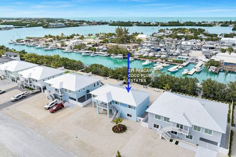 PRICED BELOW APPRAISED VALUE- New Construction 4 bedroom 3 bath home on deep water canal less than 10 minutes to direct Ocean and quick access to Gulf from Vaca Cut. This 2023 stilted concrete home built to withstand 180 mph winds with high impact wi...