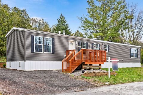 Welcome to the beautiful modular home located in Beverly Hills Estates - a Parkbridge Landlease Community conveniently located in the rolling hills of Flamborough /Puslinch. Amazing 2 bedroom, 2 full bathroom home- half way between Cambridge and Wate...