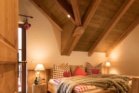 The chalet has 2 generously furnished bedrooms with double beds, one with 2 original 7 dwarf beds, as well as a covered balcony, 2 exclusive baths with underfloor heating, towel radiator and natural stone washbasin, rain shower, sauna, a rustic livin...