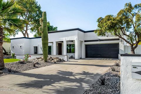 Welcome to your Scottsdale sanctuary. The backyard oasis features a sparkling pool, gazebo with outdoor kitchen, and lush landscaping. This newly remodeled home offers a perfect blend of modern design and inviting warmth. With an open-concept layout,...