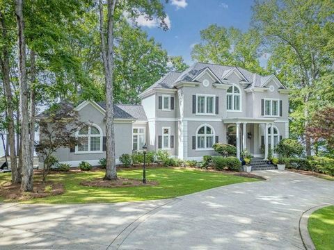 Elegantly casual perfectly describes this outstanding lakefront home, privately nestled on over an acre of gorgeous Lake Oconee shoreline with 450ft. of masonry seawall & 13ft of water at the dock . Within the gated community of Great Waters at Reyno...