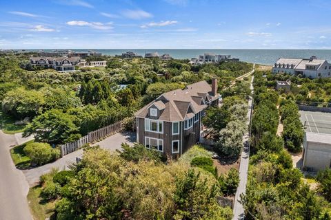 The ideal retreat on the ocean. Privacy and tranquility await at this oceanside Dune Road property nestled in the dunes and surrounded by lush gardens and natural foliage. In addition to the beautiful ocean beach, a private bayside dock for boating i...