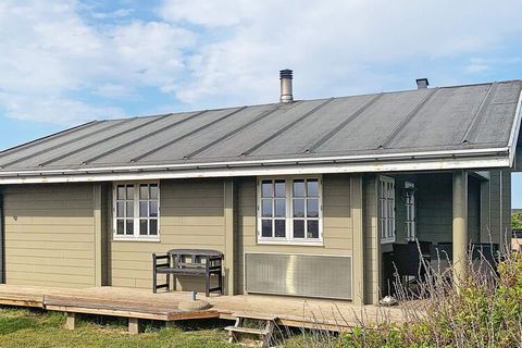 Log cabin with sauna located just about 600 meters from the North Sea overlooking Ferring lake from parts of the house and the garden approx. 300 meters away. The house is furnished with living room and kitchen in one. Here is a fantastic light incid...