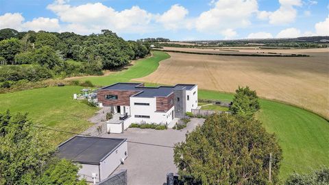 If you are looking for a substantial country property offering the ultimate in very low maintenance contemporary design, stunning rural views and immediate access to the road network for London and Canterbury, this truly amazing property that was sho...