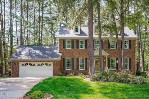 Classic all-brick 4-bedroom home, nestled among mature trees and thoughtfully landscaped grounds with irrigation system providing ample amount of shade for a more energy efficient home. The timeless appeal of the brick exterior exudes a sense of endu...