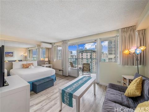 Rarely available high floor deluxe unit with ocean, mountain, and golf course views at the very popular ALOHA SURF HOTEL in the heart of Waikiki. Live in, rent as a vacation rental or put in the Aqua Hotel Rental Pool. This TURNKEY, remodeled and ful...