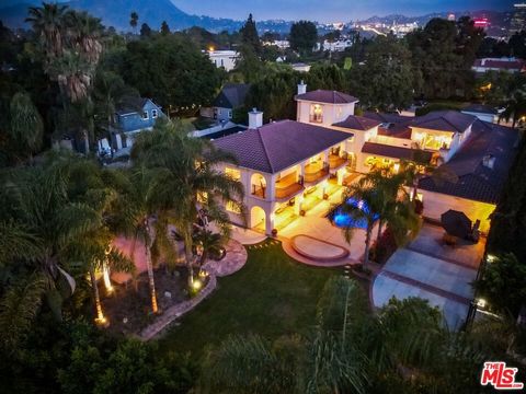 You are going to fall in love with this eclectic, Toluca Lake, gated Spanish-Mediterranean (with Santa Barbara flair) sprawling resort-like estate resting on over 3/4 acre flat! And great news, OWNER WILL CONSIDER SELLER FINANCING (PLEASE INQUIRE). T...