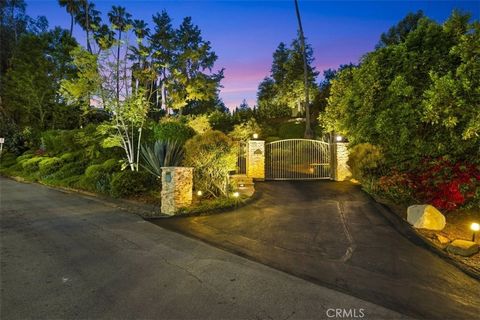 Secluded above Viviana Drive, this stunning one level Ranch and guest house is accessed by a long gated private driveway. A cul-de-sac street, offering seclusion on nearly ¾ of an acre. Located in one of the most sought-after neighborhoods in Tarzana...
