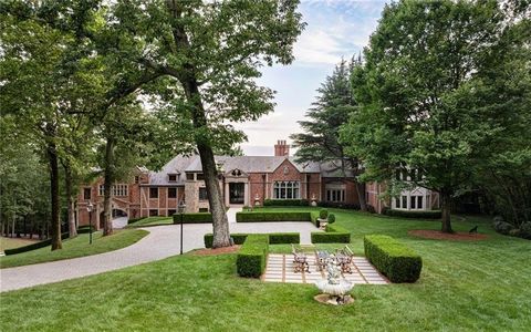 Majestic gates open to showcase a 17,000 square foot limestone and brick European inspired mansion that is strategically perched in the middle of the very private 18-acre property. The stunning architectural detail of the home exudes unparalleled gra...