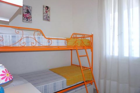 This delightful two-level holiday home on Via Vasco de Gama 22 in Porto Santa Margherita offers the perfect setting for a relaxing coastal escape. Just 350 meters from the sandy beach, the ground floor features a bright living area with a single trun...