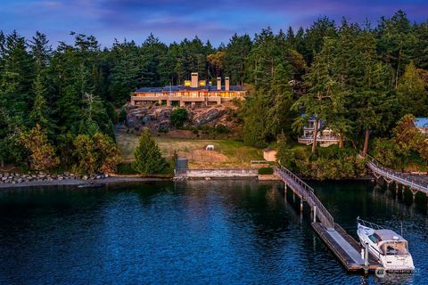 One of the most iconic homes in Friday Harbor this modern estate offers some of the Island's most stunning views. Sited down a scenic private drive & built to blend seamlessly with nature. Open spacious one-level living. Walls of windows capture the ...