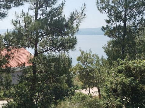 Omiš, Duće, building plot of 1207m2 on a gentle slope with an open sea view. The land is located next to the road and all the infrastructure, in a quiet location. Ideal for building one or two villas with a pool or an apartment building. It is locate...