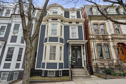 A wonderful city home: premier location, gorgeous original details in sun-filled rooms, and serene, layered outdoor space -- plus two private, income-generating apartments. Ideally located on East Broadway between L St and M Street Park, this rich an...