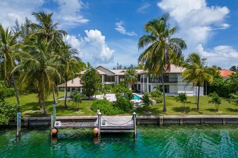 Welcome to this exceptional residence located in the heart of the prestigious gated community of Lyford Cay. Nestled on a spacious, landscaped lot, this home offers a rare combination of tranquility and breathtaking ocean and canal views. With 7 bedr...