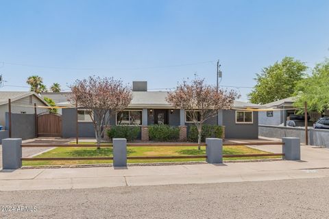 Beautifully updated home just minutes away from Phoenix College, St Joseph's Hospital, and the Encanto Park and golf course. Freshly painted inside and out, newer roof, newer air conditioning, updated kitchen & baths, dual pane windows and front-load...