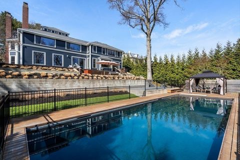 Introducing a rare exquisite residence in Brookline's coveted Fisher Hill neighborhood. This stunning 5 bedroom+ estate masterfully blends historic traditional exterior with sleek design & stunning contemporary interior. Meticulously renovated to per...