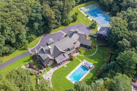 Introducing a custom-built Adirondack-style masterpiece, set on over 5 acres of pristine land. Designed with care by the current owners, this home boasts a seamless layout, ideal for entertaining. Spacious, elegantly appointed rooms feature a custom-...