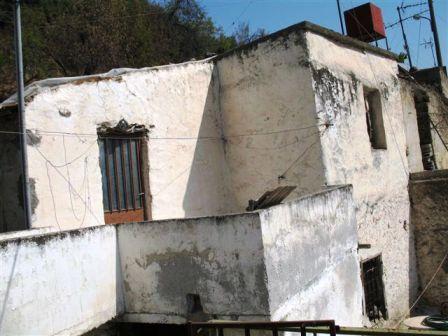 Choumeriako – Agiou Nikolaou In the village of Houmeriako, old 2-storey traditional house 85m2, consisting of 3 rooms on the ground floor and 2 rooms up, with a veranda. Electric and water connected.Also, north of the house is a plot of 122 m2 with c...