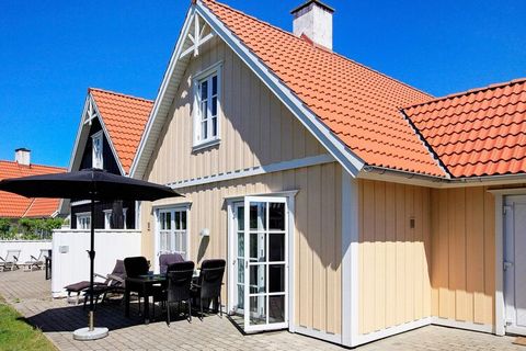 Holiday cottage with whirlpool and sauna located in quiet surroundings and with an idyllic atmosphere at Blåvand. The house was built in a Swedish-inspired style in 2 levels and with bright colours. Open concept kitchen and bright living room. In the...