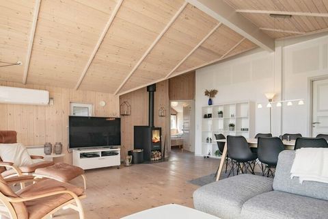 This holiday cottage is located in the scenic Råbjerg, built in solid materials. The kitchen section is combined with the large and bright living and dining room, from where you can access the terrace. The large windows ensures a great inflow of ligh...